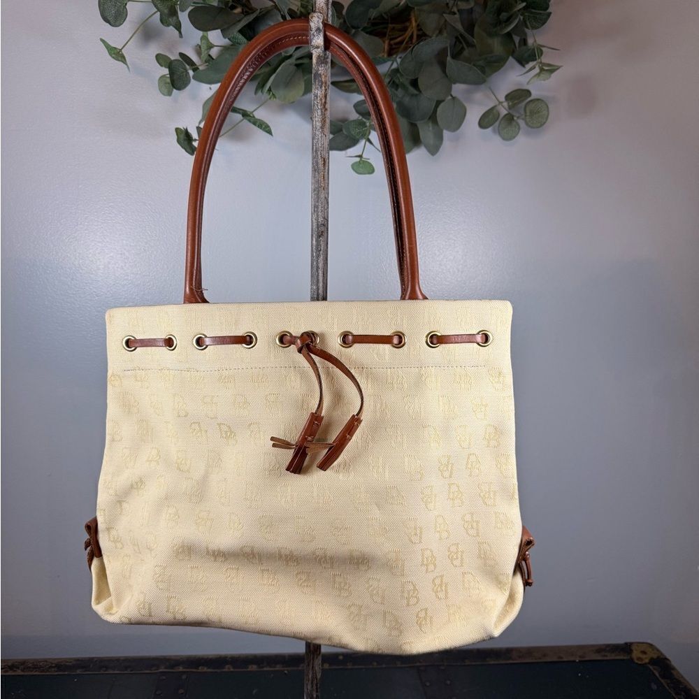 Dooney and Bourke  Beige Canvas and Leather Signature Tassel Tote Handbag